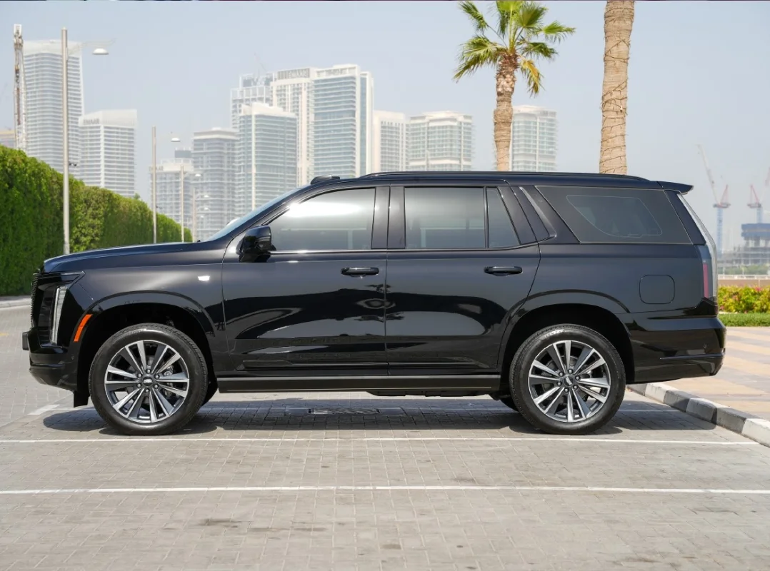 Luxury SUV driving through Dubai skyline