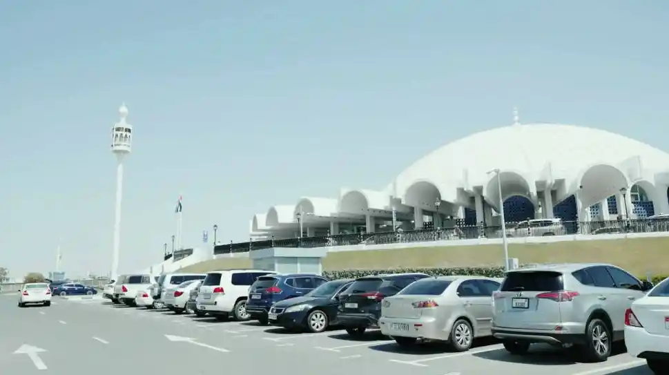 Luxury SUV driving through Dubai skyline